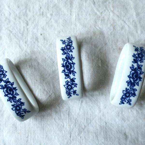 Vintage three porcelain napkin rings with blue floral pattern