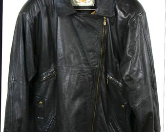 May include: Black leather jacket with a diagonal zipper, multiple pockets, and a collared neckline. The jacket is hanging on a wooden hanger. The label reads "MAX BOSTON".