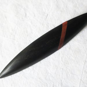 Vintage brooch made of black ebony