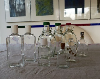 Vintage small beautiful glass bottles to decorate with stoppers