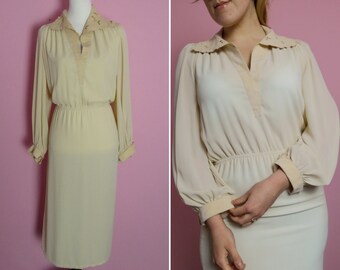 flowy cream dress with sleeves