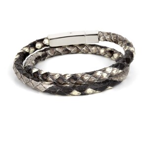 May include: A double-wrap bracelet made of black and white snakeskin with a silver clasp.