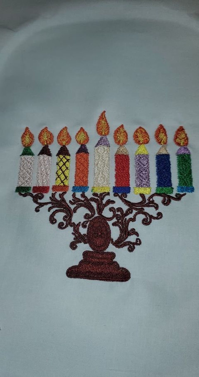 Customer sewout of digitized logo stitched on garment, showing precise and clean embroidery results.