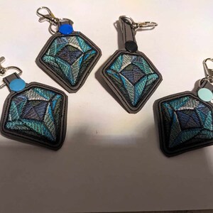 Digitized keyfobs for a customer! Example of professional digitizing service results for branding and uniforms