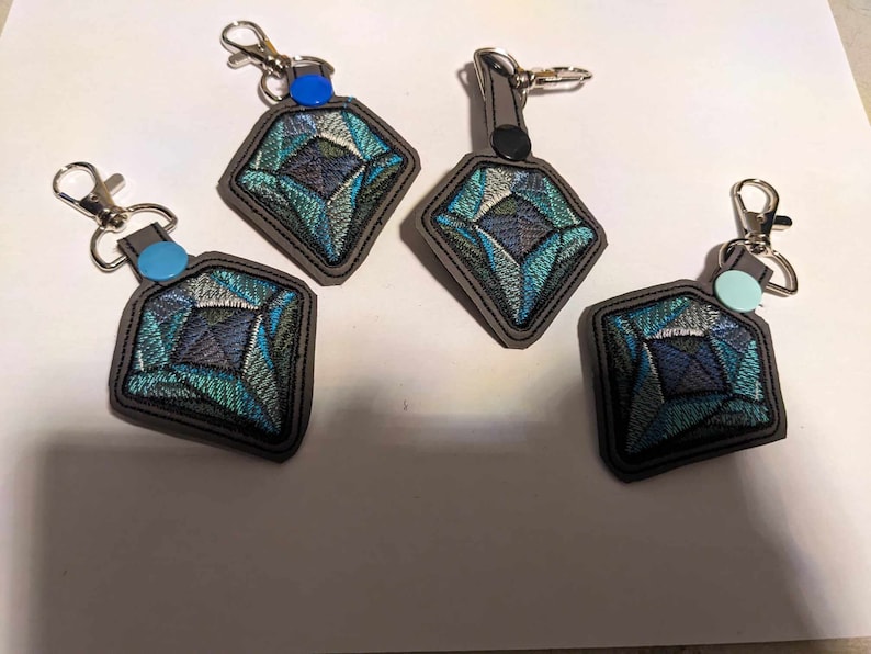 Digitized keyfobs for a customer! Example of professional digitizing service results for branding and uniforms