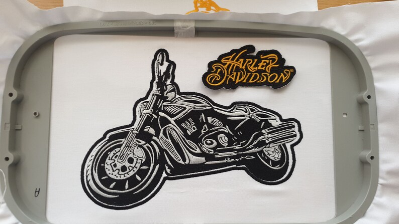 Close-up preview of embroidery digitizing stitch-out sample, showing clean edges and precise stitch density.