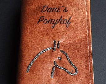 Personalized horse passport folder made of brown leather with horse hair (also from your own horse) as a braided horse head