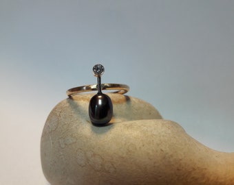 Ring, Rosegold 585 mit schwarzer Perle und Zirkon
