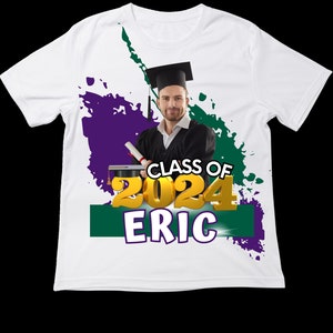 May include: White t-shirt featuring a graduation design. The design includes a graduate in a cap and gown, the text "CLASS OF 2024 ERIC" in gold and white, and green and purple paint splotches.