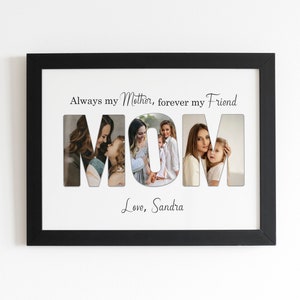 May include: Black framed photo collage with the word "MOM" cut out, revealing family photos. The text above reads "Always my Mother, forever my Friend." Below, the text says "Love, Sandra."