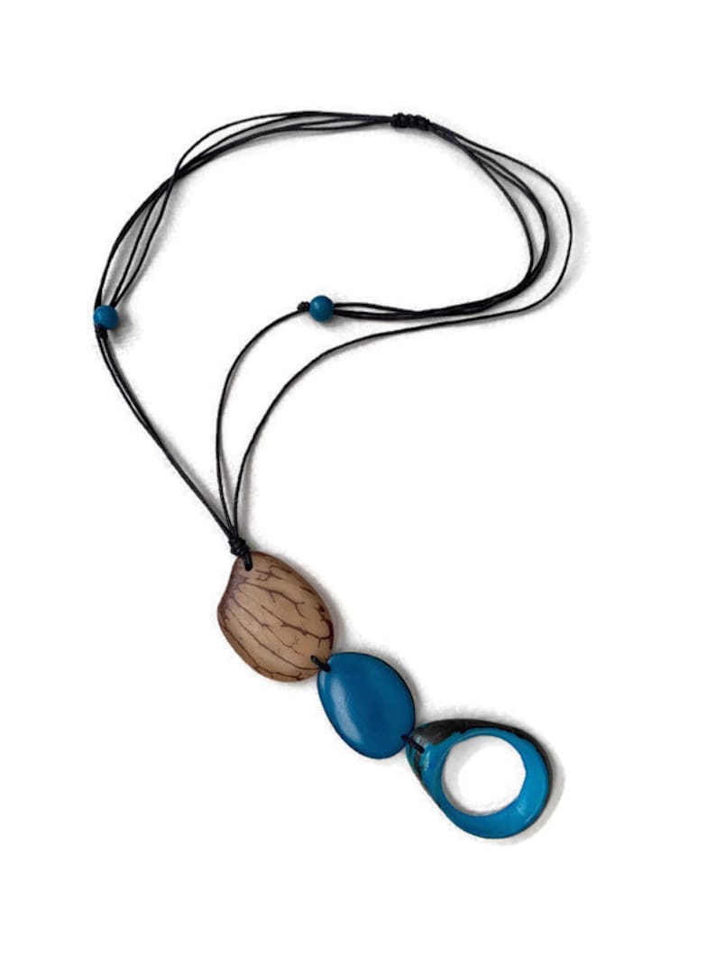 May include: A long necklace with a brown and blue pendant. The pendant is made of three pieces: a brown oval, a blue oval, and a blue oval with a hole in the center.