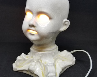 The Original Creepy Doll head lamp.