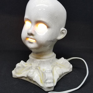 The Original Creepy Doll head lamp.