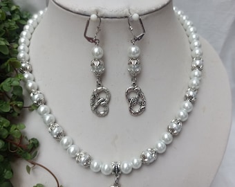 Traditional costume jewellery set made of white pearls with pearl caps + pretzel charms