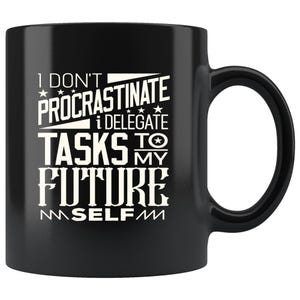 May include: Black ceramic mug with a white graphic that reads "I don't procrastinate, I delegate tasks to my future self." The mug has a curved handle and a glossy finish.