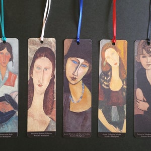 May include: Set of five bookmarks featuring paintings by Amedeo Modigliani. Each bookmark is printed with a different portrait of a woman, including "Gypsy Woman with Baby", "Portrait of Jeanne Hebuterne", "Jeanne Hebuterne with Hat and Necklace", "Jeanne Hebuterne, original", and "Portrait of Madame Raymond".