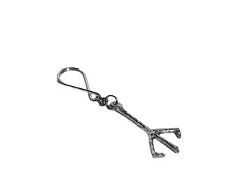 Portachiavi e ciondolo per collana con simbolo del cacciatore