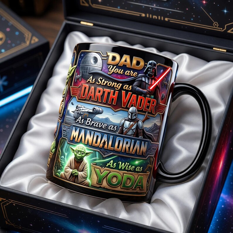 May include: A black ceramic mug with a Star Wars theme, featuring Darth Vader, the Mandalorian, and Yoda. The mug has the text "DAD You are As Strong as Darth Vader, As Brave as Mandalorian, As Wise as Yoda." The mug is presented in a decorative box.