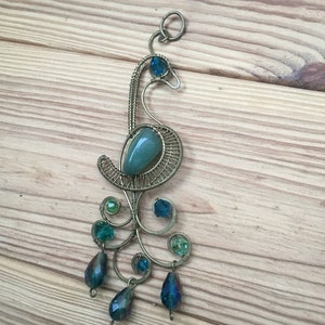 This beautiful handmade keychain is made of wire and beads.