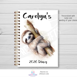 May include: A white diary with a spiral binding, featuring a sloth illustration. The cover reads "Carolyn's" and "2026 Diary". The text "Personalised with name and wording of your choice" is also visible. The diary is printed on 250gsm card.