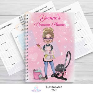 May include: A pink spiral-bound cleaning planner with the text "Yvonne's Cleaning Planner". The cover illustration shows a woman with glasses, an apron, and cleaning tools. Additional cleaning checklists are visible.