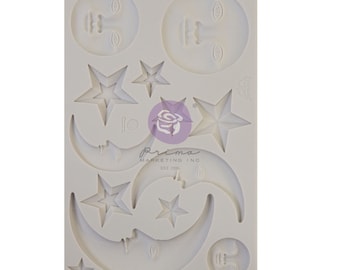 May include: Silicone mold with 10 different shapes, including moons, stars, and faces. The mold is white and has the text "Prima Marketing Inc. Est. 1999" on it.