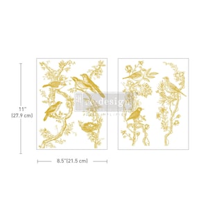 May include: Two sheets of gold-toned decorative paper with a repeating pattern of birds and branches. The paper measures 8.5 inches by 11 inches.