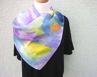 A beautiful shiny silk scarf made of silk crepe de chine, hand painted in quite a few fresh colors