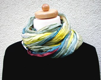 Silk scarf crushed, painted with French colors in the color gradient along rust, petrol, green, light green, petrol, yellow.