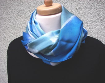 Silk scarf made of silk twill, painted with French colors in light blue, blue, petrol, the wool white color appears in some places.