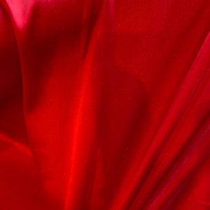 Pure silk ( mulberry silk) in bright red width 55.12 inc sold by the yard
