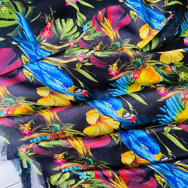 Very delicate lightweight natural silk, brightly coloured parrots on a black background. Famous designer made in Italija