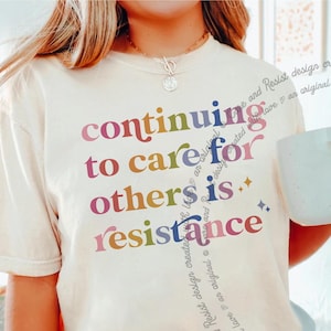 Continuar a cuidar dos outros é resistência, camiseta com cores confortáveis, camiseta com empatia, camiseta com resistência, camiseta com direitos humanos, camiseta com cuidado com os outros