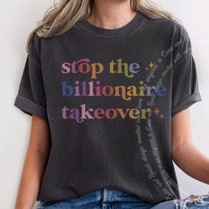 May include: A dark gray t-shirt with the text "Stop the Billionaire Takeover" in rainbow colors. The text is in a retro font style.