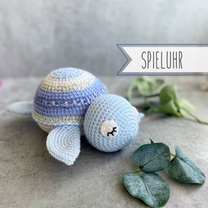 Lovingly crocheted music box turtle for little boys with great wool in shades of blue; machine washable; approx. 20x17x9cm