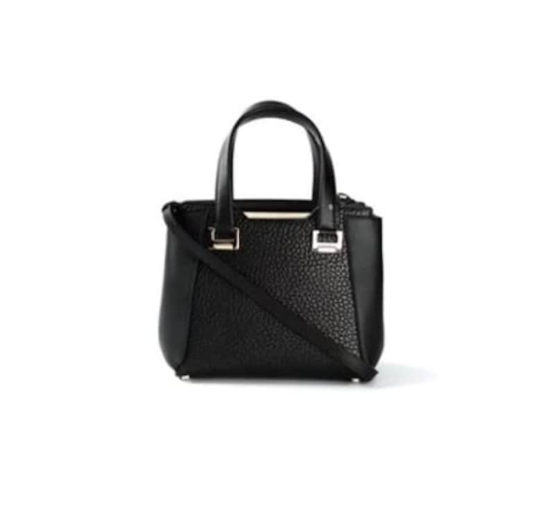 May include: A black leather handbag with a top handle and a shoulder strap. The bag has a textured finish and silver hardware.