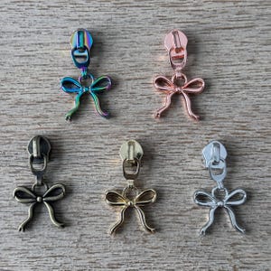 Ribbon Bow zipper pulls (5 pcs) designed for #5 nylon zipper tape.  No. 5 zipper pulls
