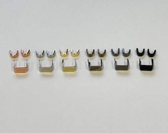 May include: Eight sets of metal zipper pulls in different finishes: rose gold, silver, gold, gunmetal, nickel, black nickel, and black. Each set includes two zipper pulls.