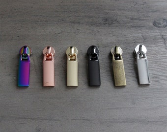 Rectangle zipper pulls (5 pcs) designed for #5 nylon zipper tape.  No. 5 zipper pulls