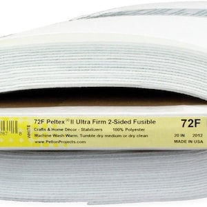 May include: A roll of white Pellon 72F Peltex II Ultra Firm 2-Sided Fusible fabric. The label indicates it is 20 inches wide and made of 100% polyester. Ideal for crafts and home decor projects.