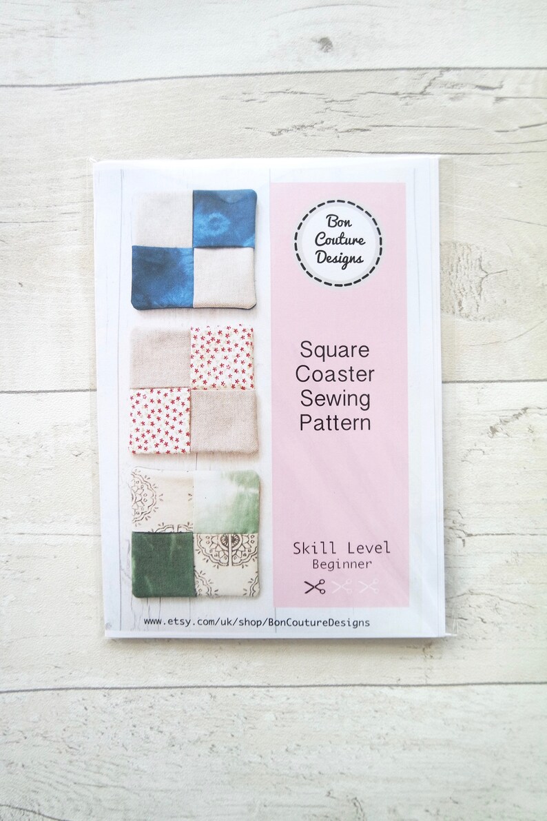 May include: A printable sewing pattern for square coasters. The pattern includes three different designs with fabric swatches. The pattern is for beginner sewers and is titled "Square Coaster Sewing Pattern".
