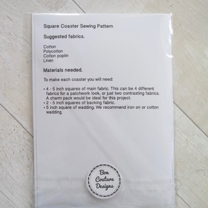 May include: A white sheet of paper with instructions for making a square coaster. The instructions include a list of materials needed, such as cotton fabric, backing fabric, and wadding. The paper also includes the text "Square Coaster Sewing Pattern" and "Bon Couture Designs".