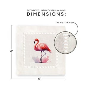 May include: A white linen cocktail napkin with a pink flamingo illustration and hemstitched edges. The napkin measures 6 inches by 6 inches.