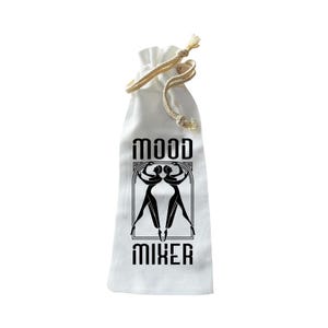 May include: A white drawstring bag with the words "MOOD MIXER" in black, stylized font. The bag features a black graphic of two figures in an art deco style. The drawstring is a natural beige color.