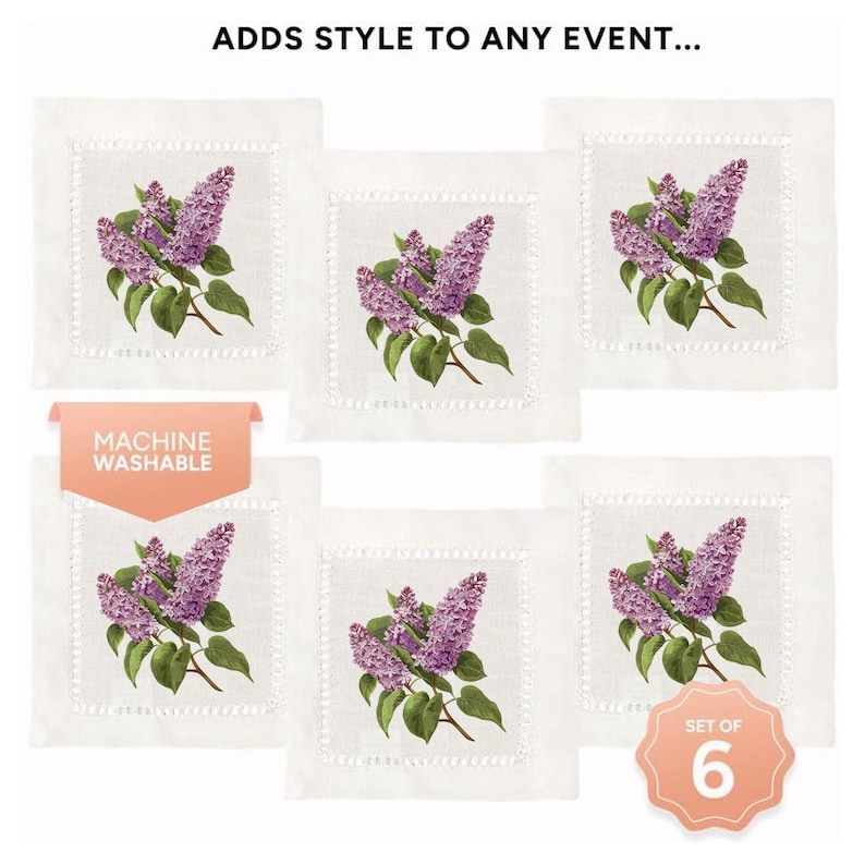 May include: Set of six white linen cocktail napkins with a purple lilac floral design. The napkins are machine washable and have a delicate embroidered border. "Set of 6" is printed on a peach-colored circle.
