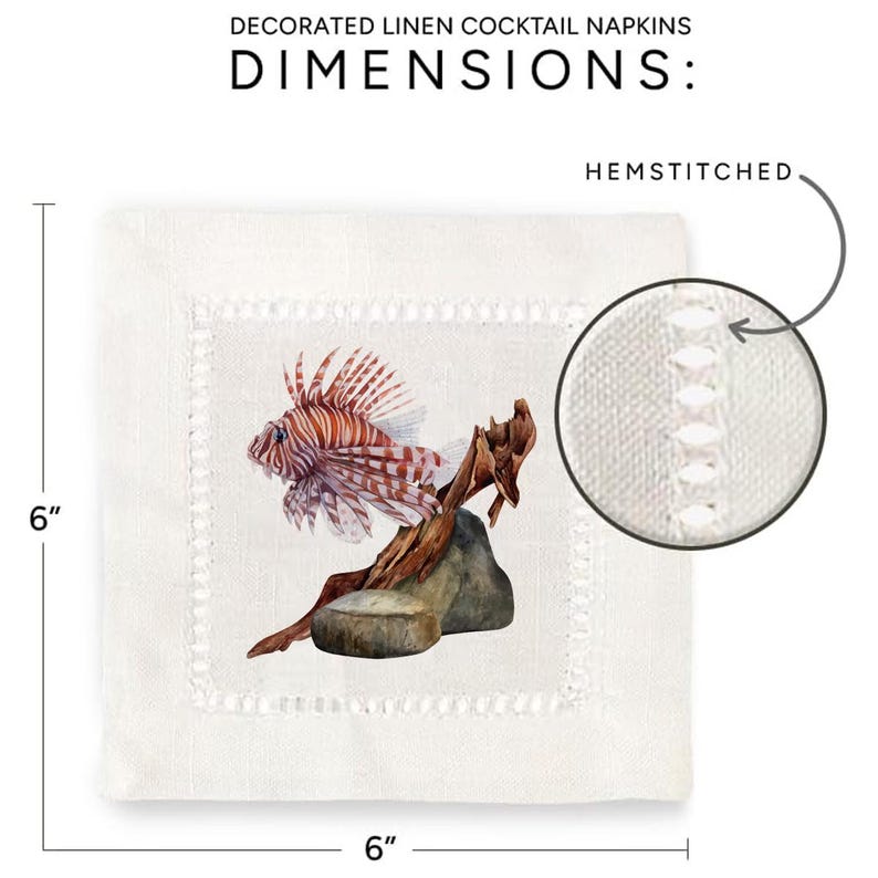 May include: White linen cocktail napkin with a hemstitched border. The napkin features a watercolor illustration of a lionfish on a piece of driftwood. The napkin measures 6 inches by 6 inches.
