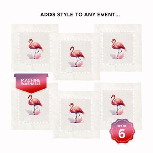 May include: Set of six white linen cocktail napkins with pink flamingo illustrations. The napkins are machine washable and feature a delicate embroidered border.
