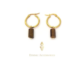 May include: Gold hoop earrings with a brown tiger's eye stone pendant.  The earrings are a simple and elegant design.