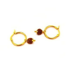 May include: A pair of gold hoop earrings with a brown bead charm hanging from each hoop.
