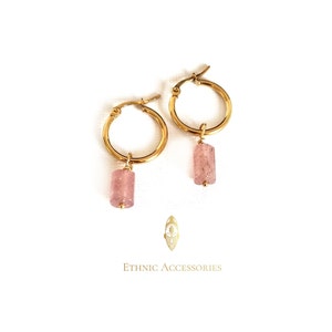 May include: Gold hoop earrings with a pink stone pendant. The earrings are simple and elegant, perfect for everyday wear.